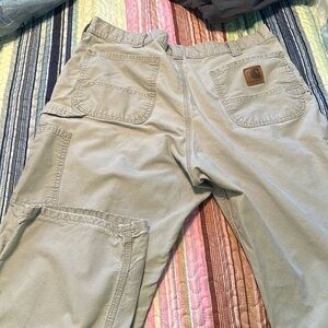Well Loved Carhartt pants. Has 2 small holes. See pictures